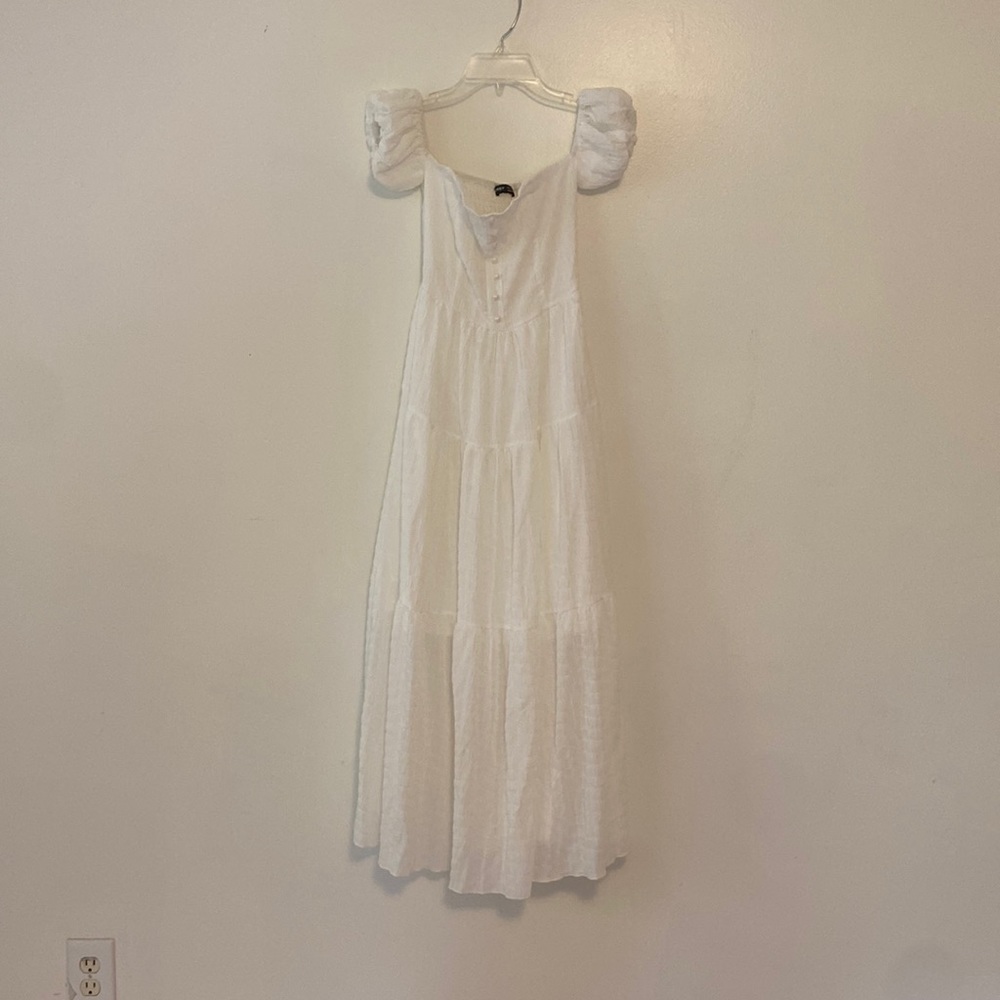 Floor-length white ruffle dress